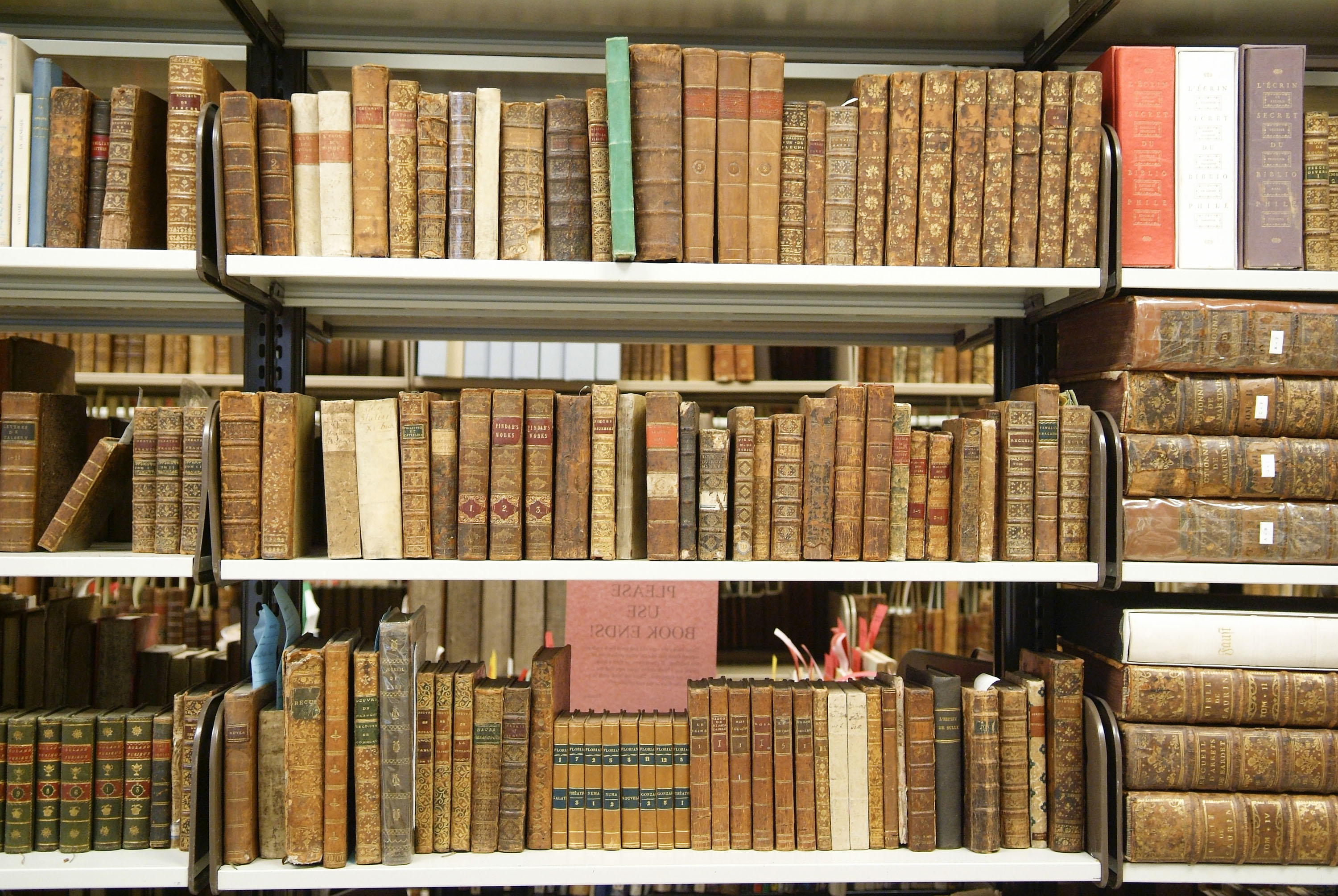A bookshelf of rare books at the Cushing Library at Texas A&M University